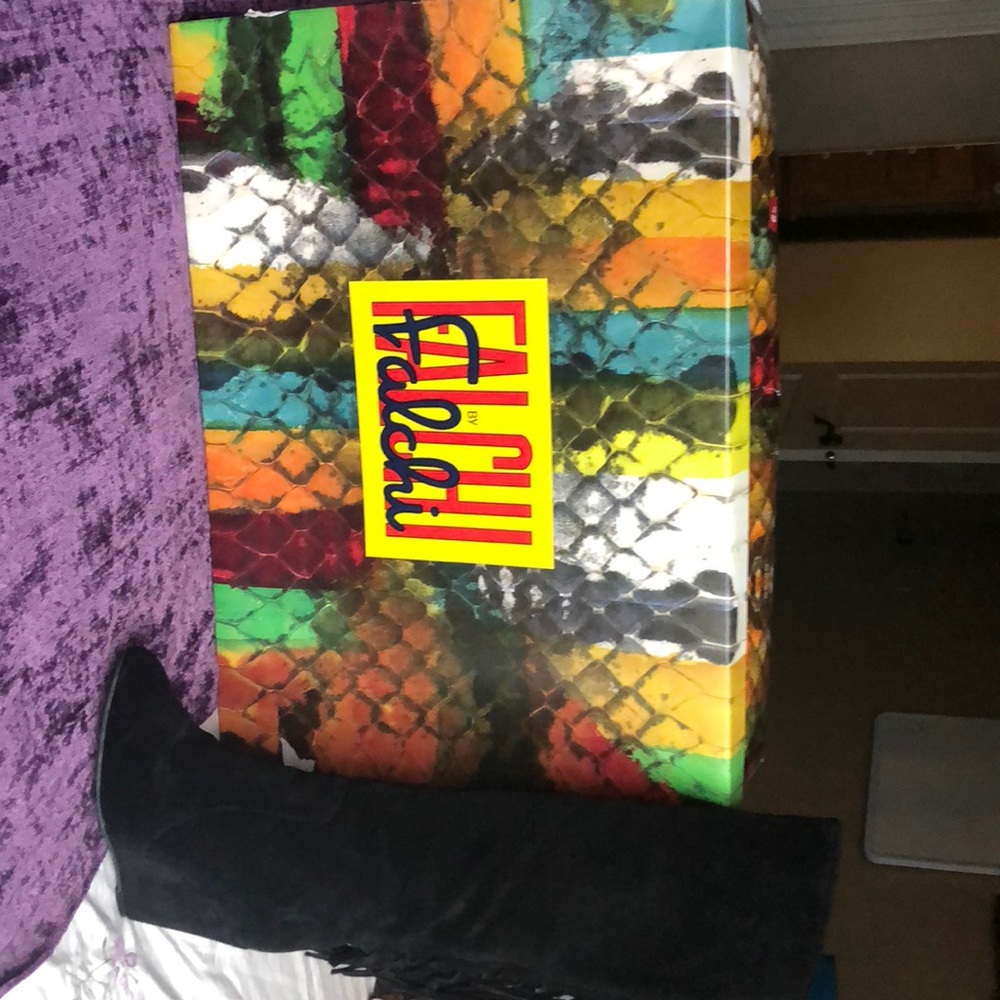 Frilly, black, knee high boots from Falchi.